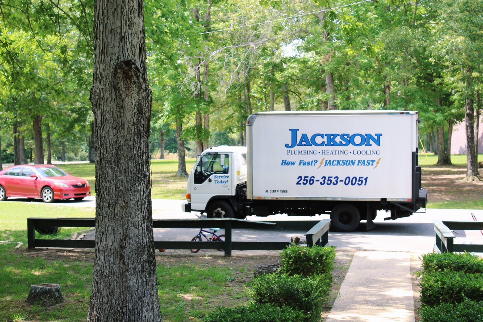 Jackson Heating and Cooling truck in front of Huntsville residence